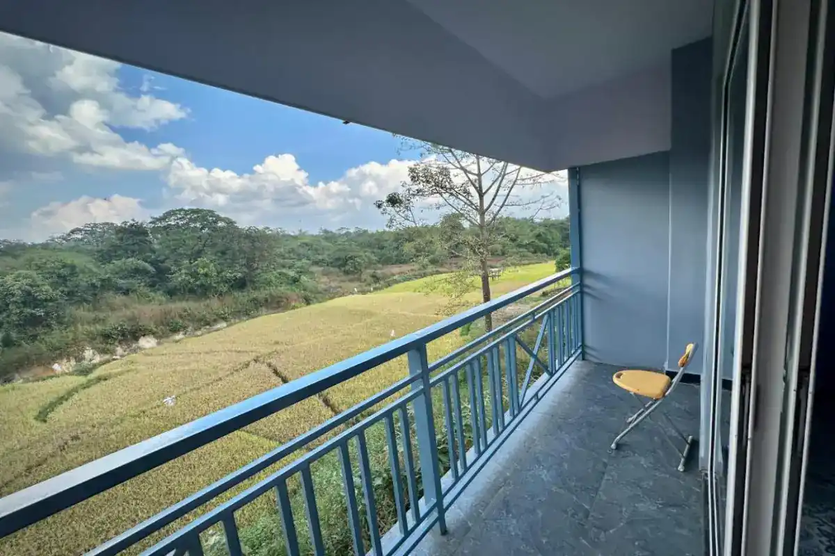 AC Deluxe cottage with private balcony overlooking gardens at B Hive Resort