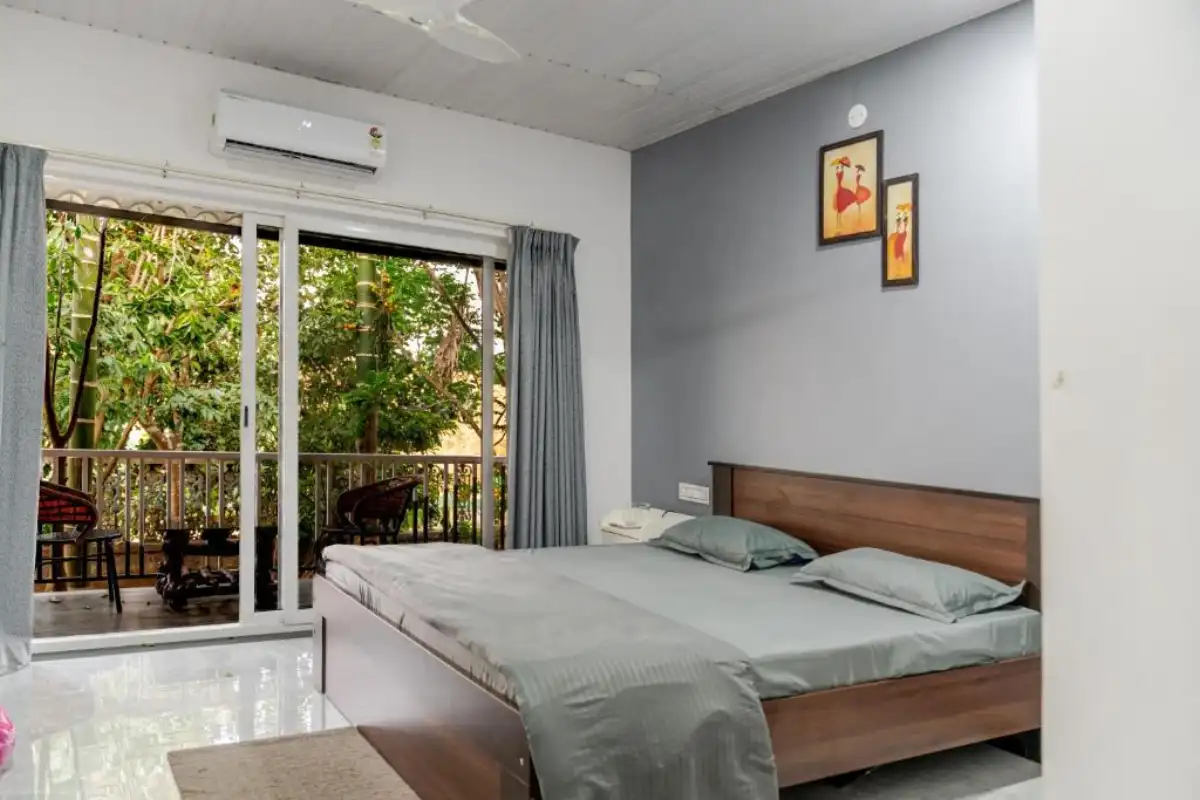 AC Deluxe cottage room with large window and natural light at B Hive Resort Londa