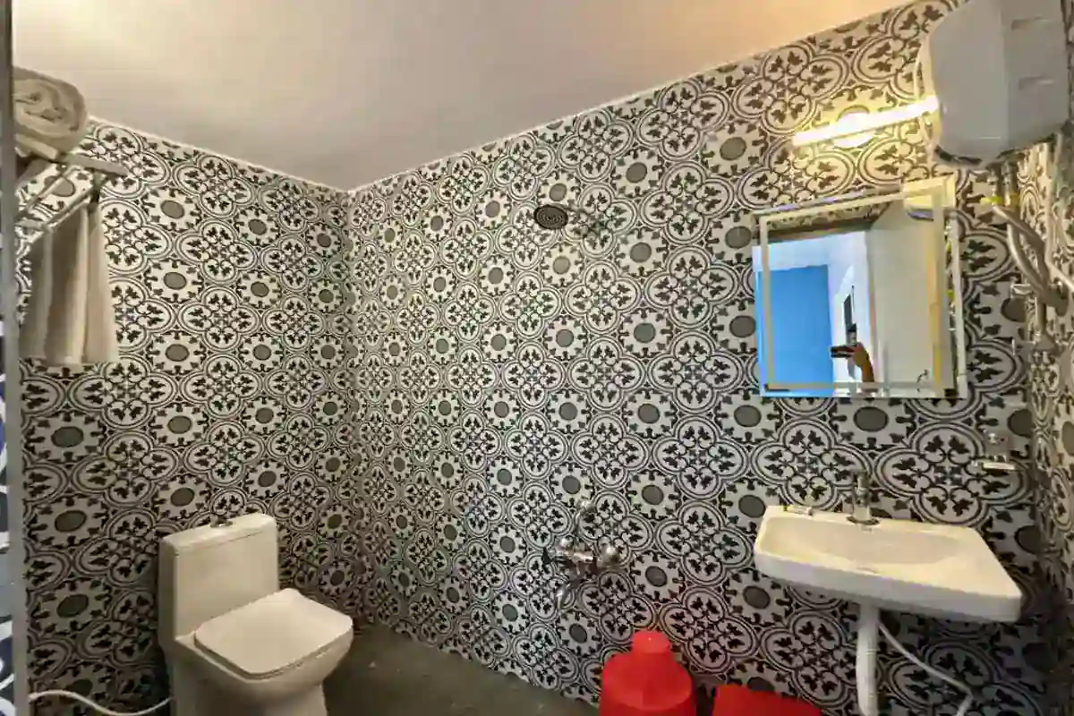 Clean attached washroom with modern fittings in AC Standard cottages at B Hive